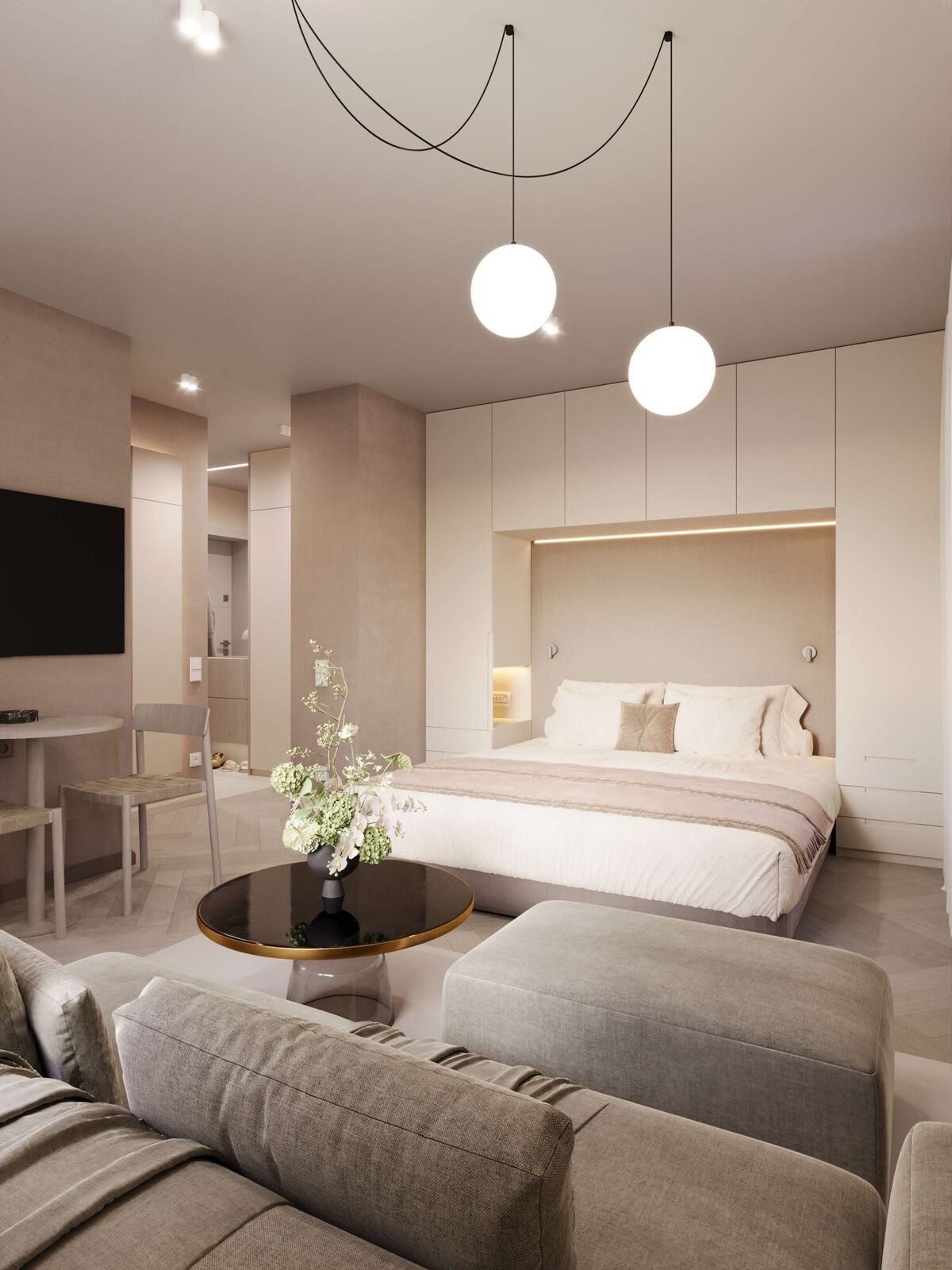 Wohnbereich mit Bett, Sofa und Pendelleuchten