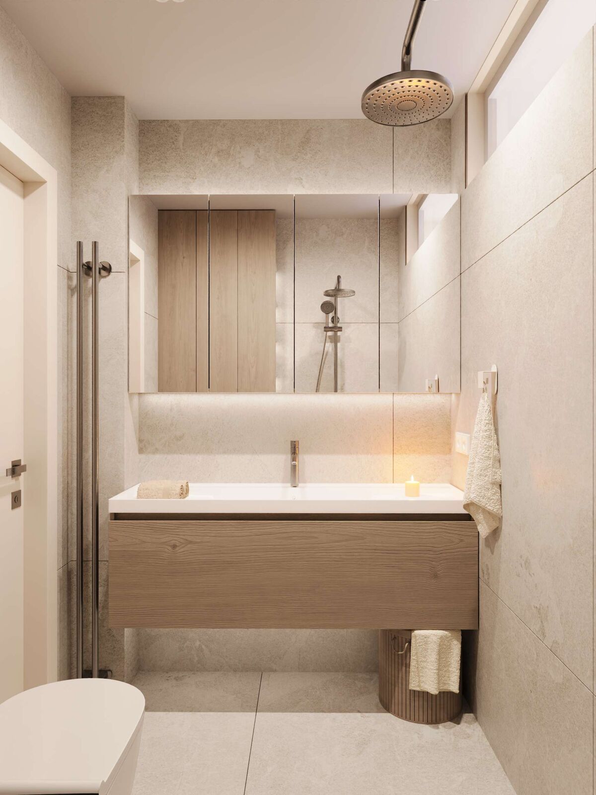 Badezimmer mit Holzwaschtisch und beleuchtetem Spiegel
